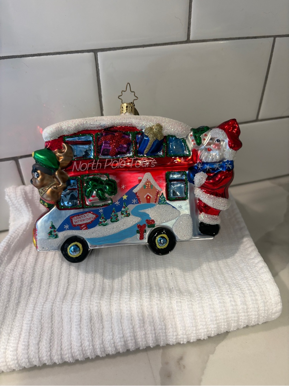 Christopher Radko “North Pole Tours” glass ornament.  Excellent condition.